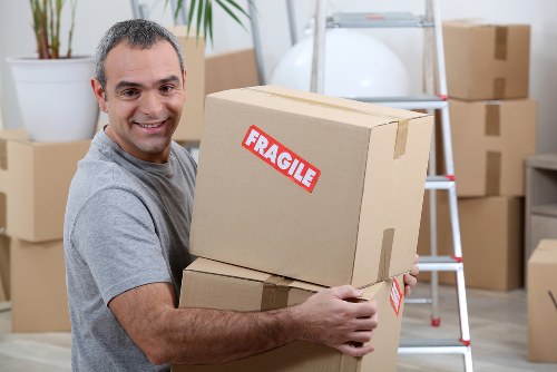 Experienced movers loading items onto a van