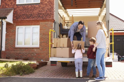 Professional removals team handling household items
