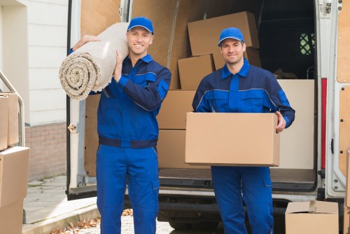 Professional movers handling furniture