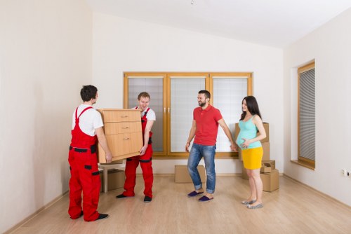 Professional movers handling furniture in Kingston